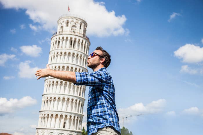 a man photoshopped hugging and kissing the leaning tower of pisa