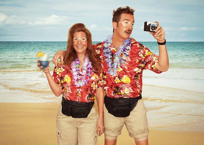 two tourists wearing khakis, floral shirts, very bad sunburns, and cameras