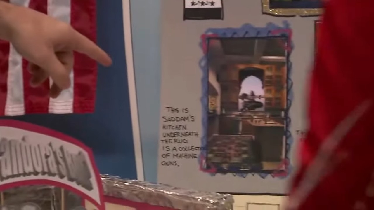 Michael pointing at a picture of Saddam Hussein&#x27;s kitchen in &quot;Arrested Development&quot;