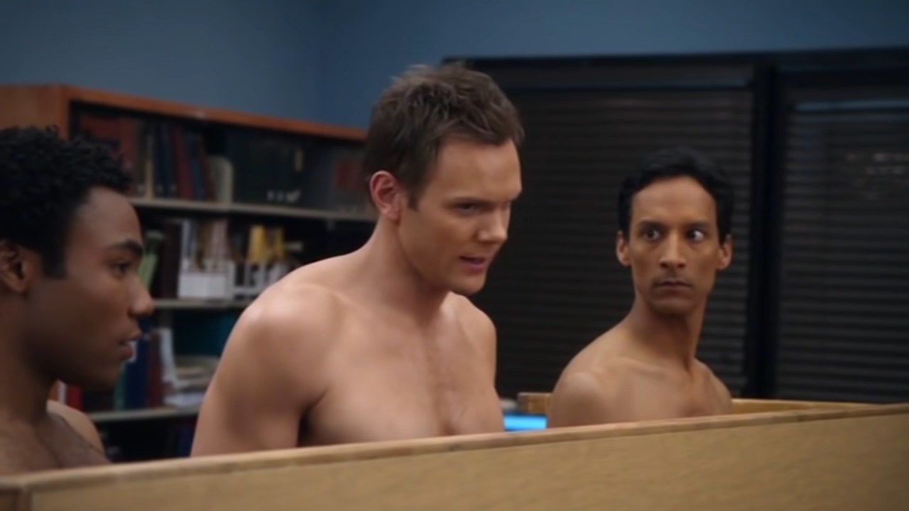 Troy, Jeff, and Abed standing in their underwear behind an overturned table in &quot;Community&quot;