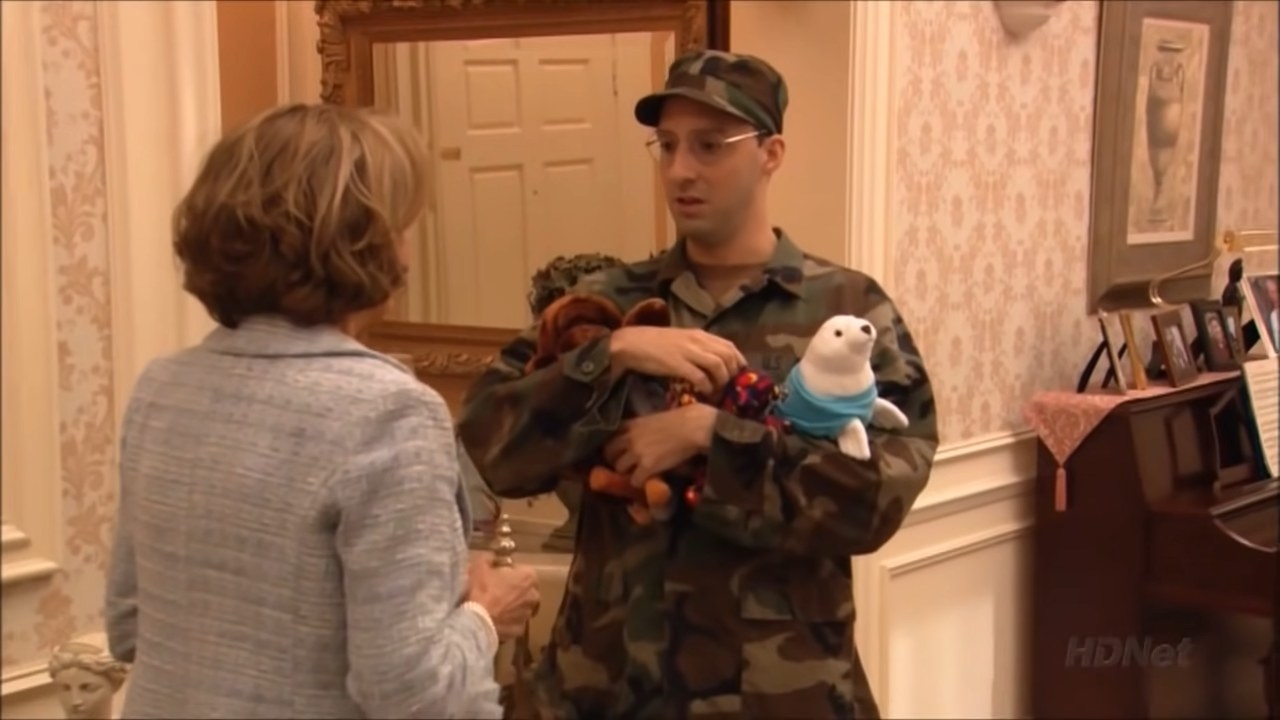Buster talking with Lucille while holding plush toys in &quot;Arrested Development&quot;