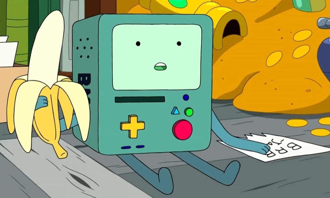 BMO holding a banana with a look of shock after hearing something Finn said