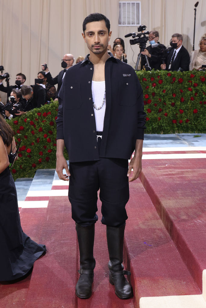 Riz in a utility jacket and pants, paired with utility boots