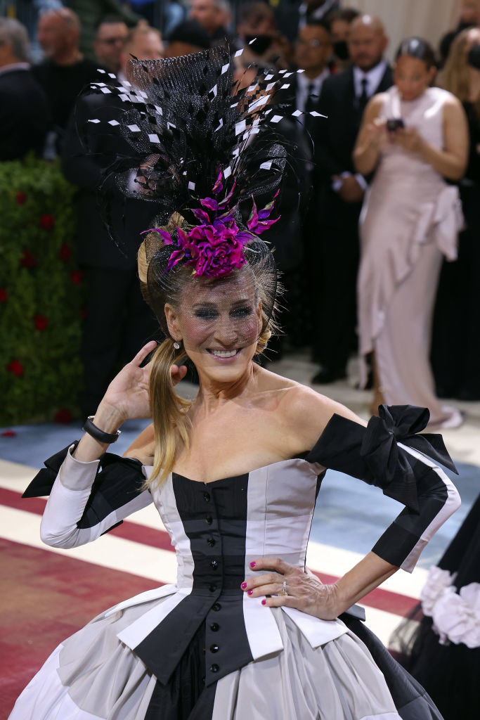 SJP wears a checkered ballgown, paired with a big fascinator with feathers