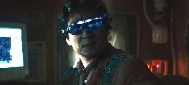 Ke Huy Quan as Alpha Waymond, wearing light-up glasses