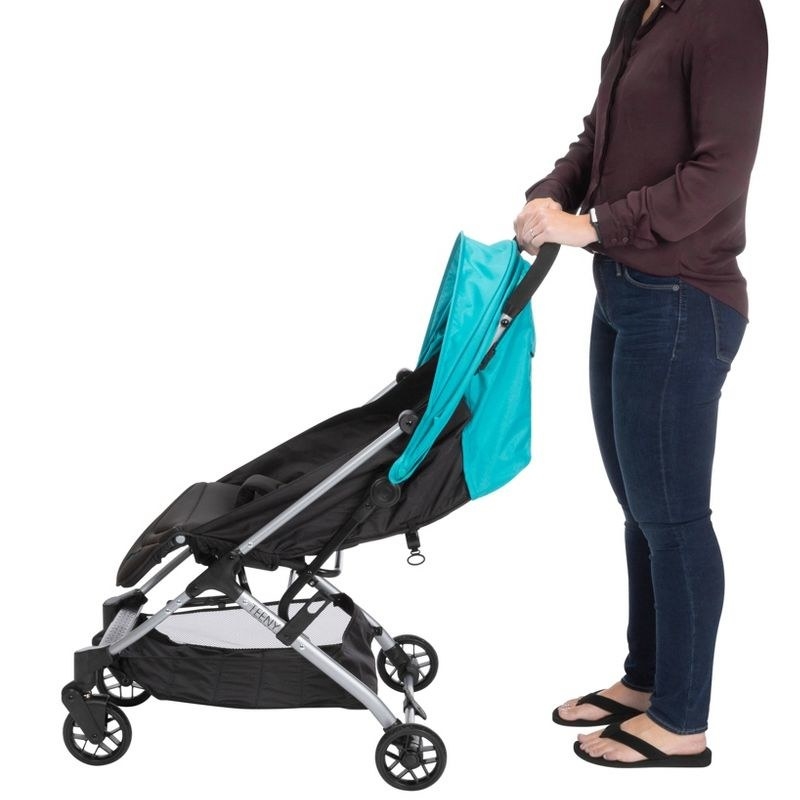 Person with compact stroller