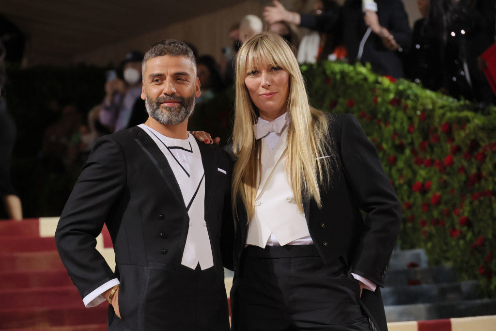Oscar Isaac and Elvira Lind wear matching dark suits