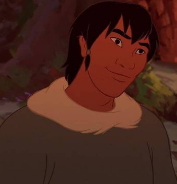 A close up of Denahi as he wears a sweater with a fur collar