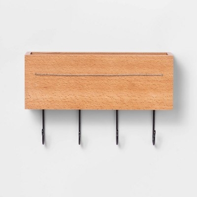 the wooden wall storage with metal hooks