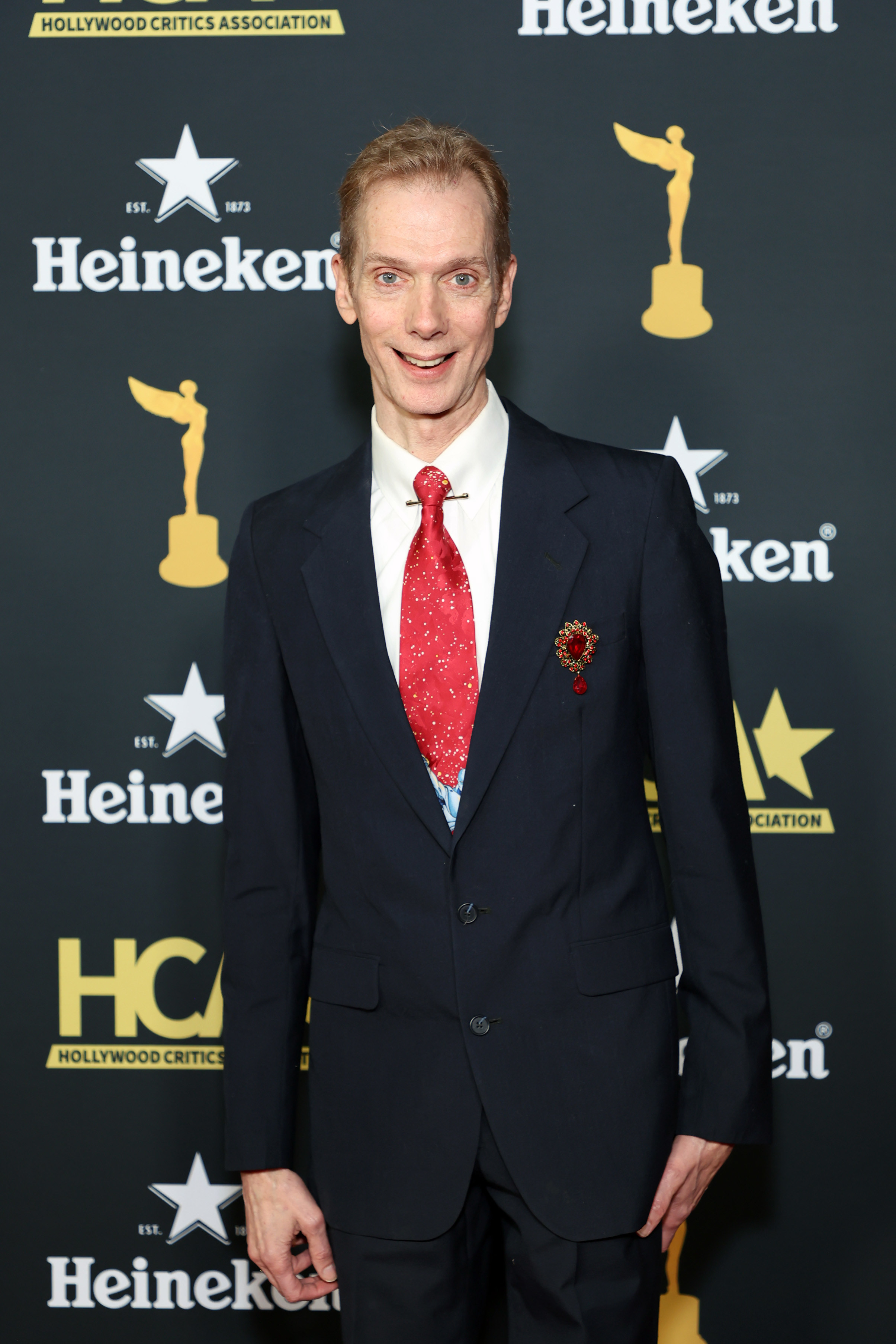 Doug Jones at an event, wearing a suit