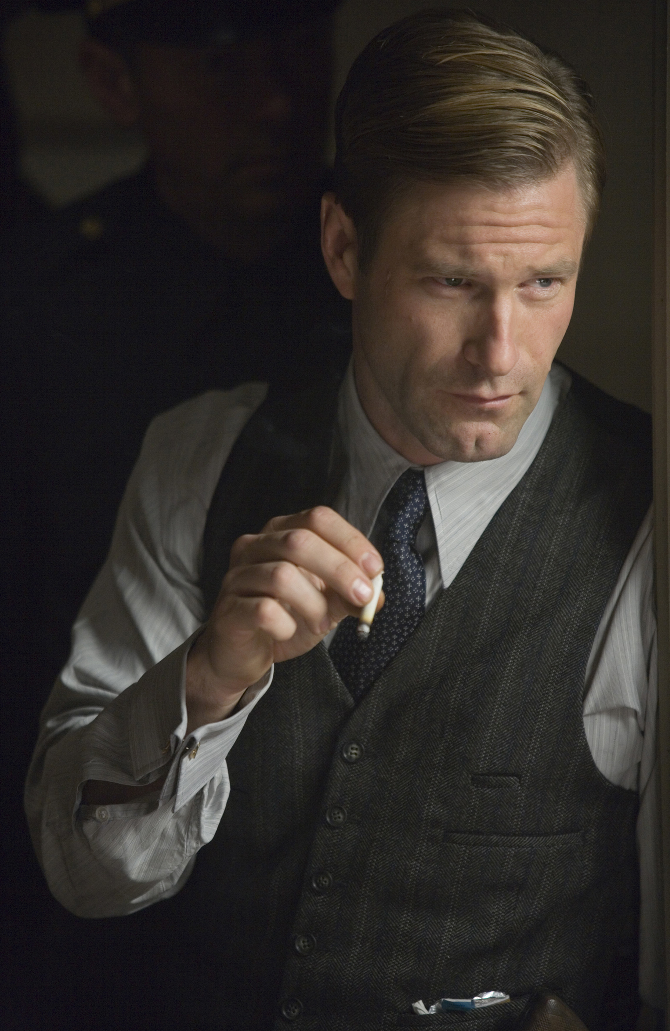 Aaron Eckhart in a suit