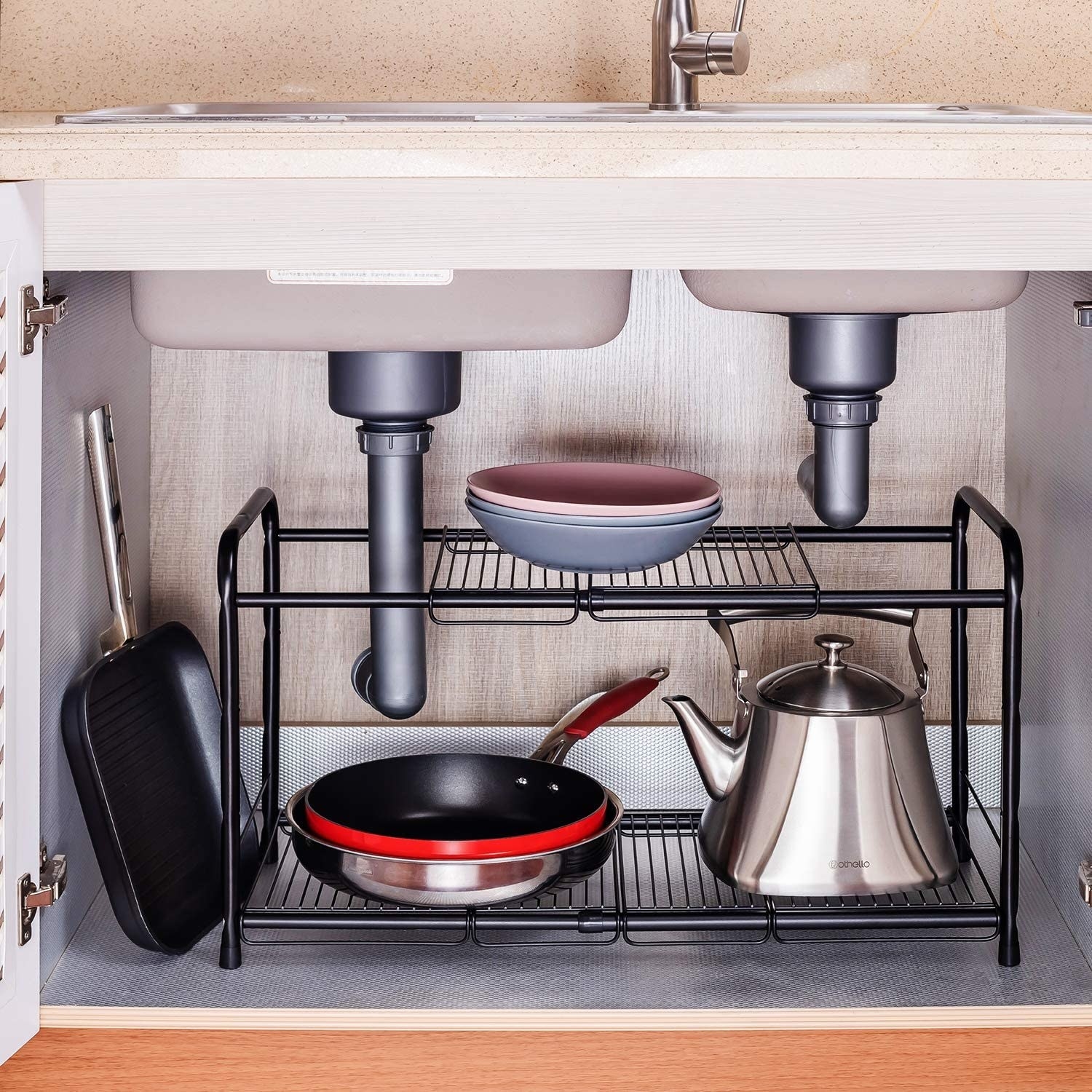 the expandable metal rack underneath a kitchen sink