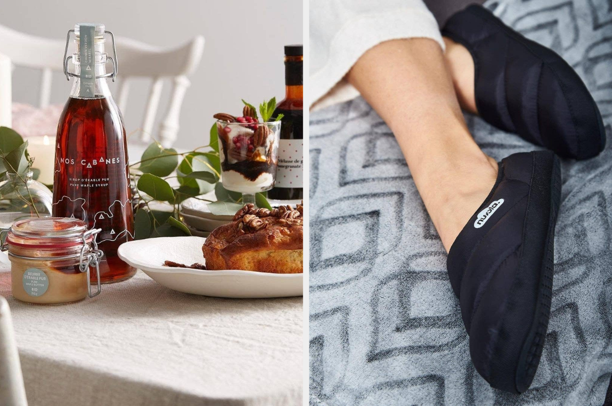 A dining table with a glass bottle of maple syrup on it, A person wearing puffy slippers on their feet