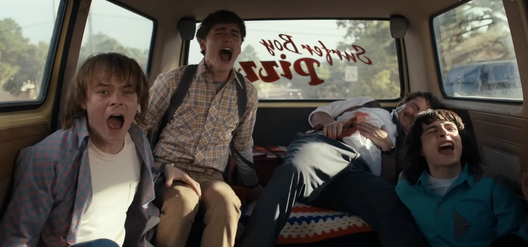 Jonathan, Will, and Mike screaming in the back of Argyle&#x27;s van in &quot;Stranger Things&quot;