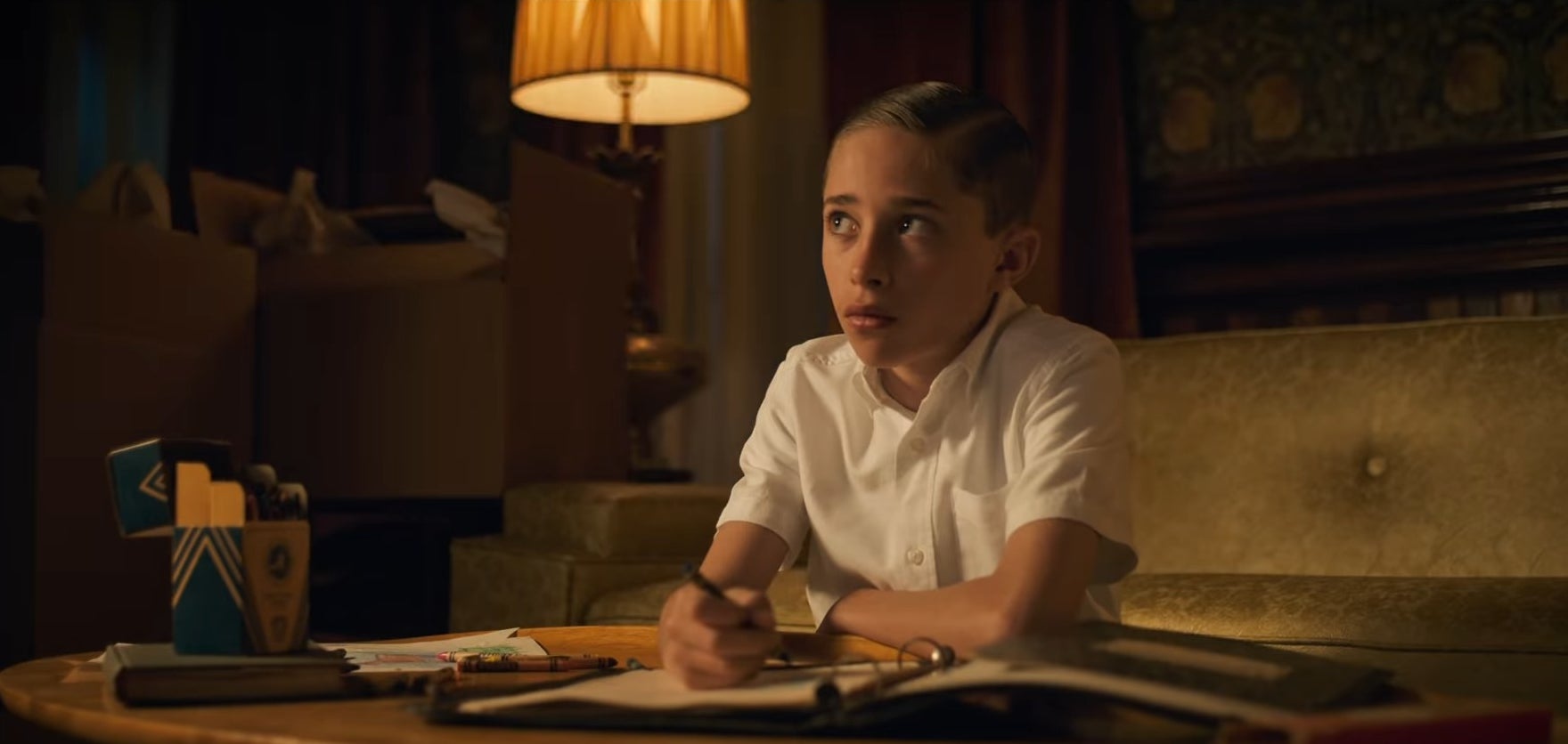 A young Henry Creel coloring in his binder in &quot;Stranger Things&quot;