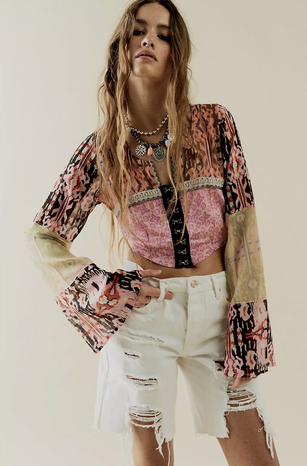 Model in the patterned statement top
