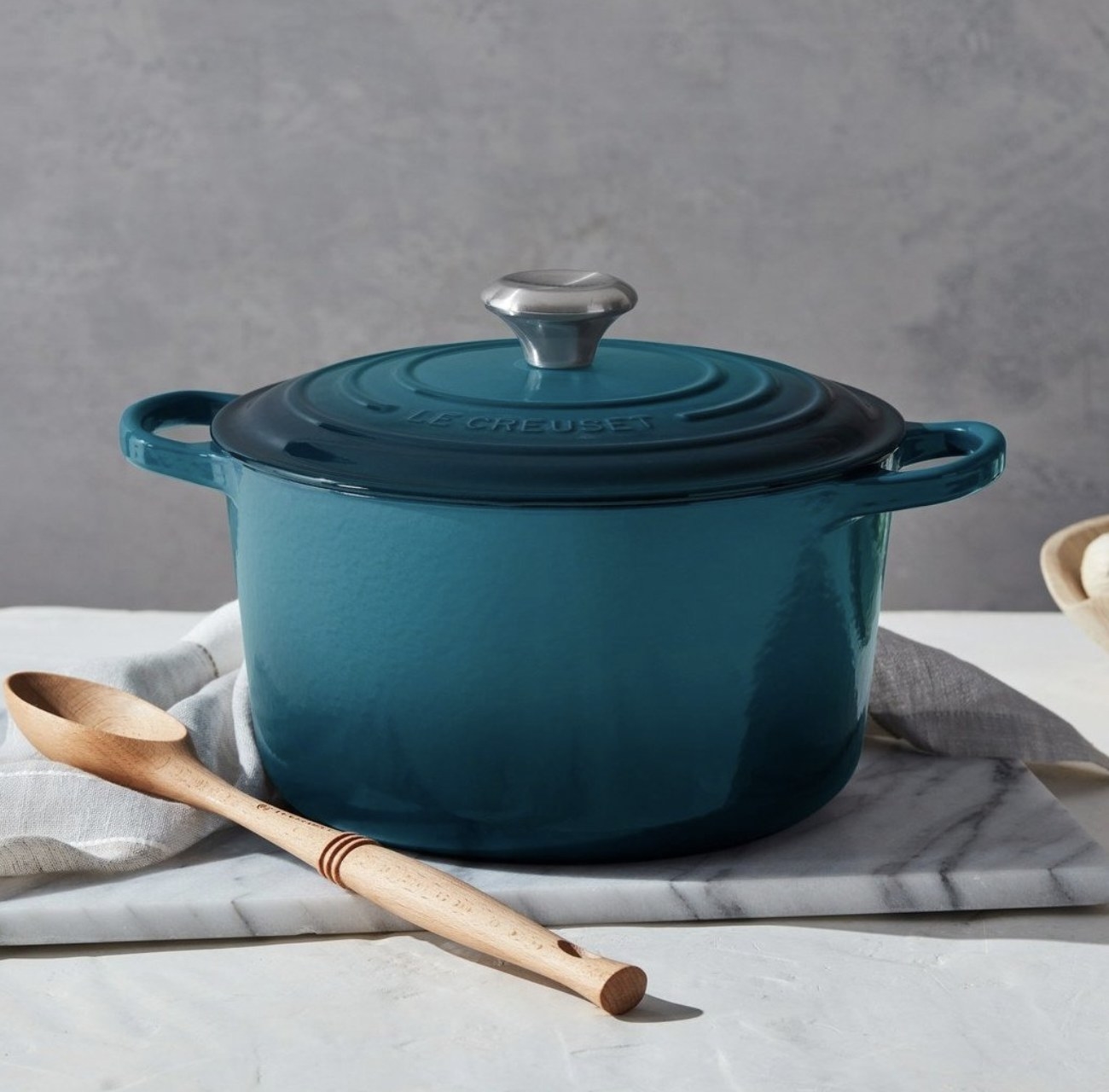 The blue dutch oven sitting on kitchen countertop