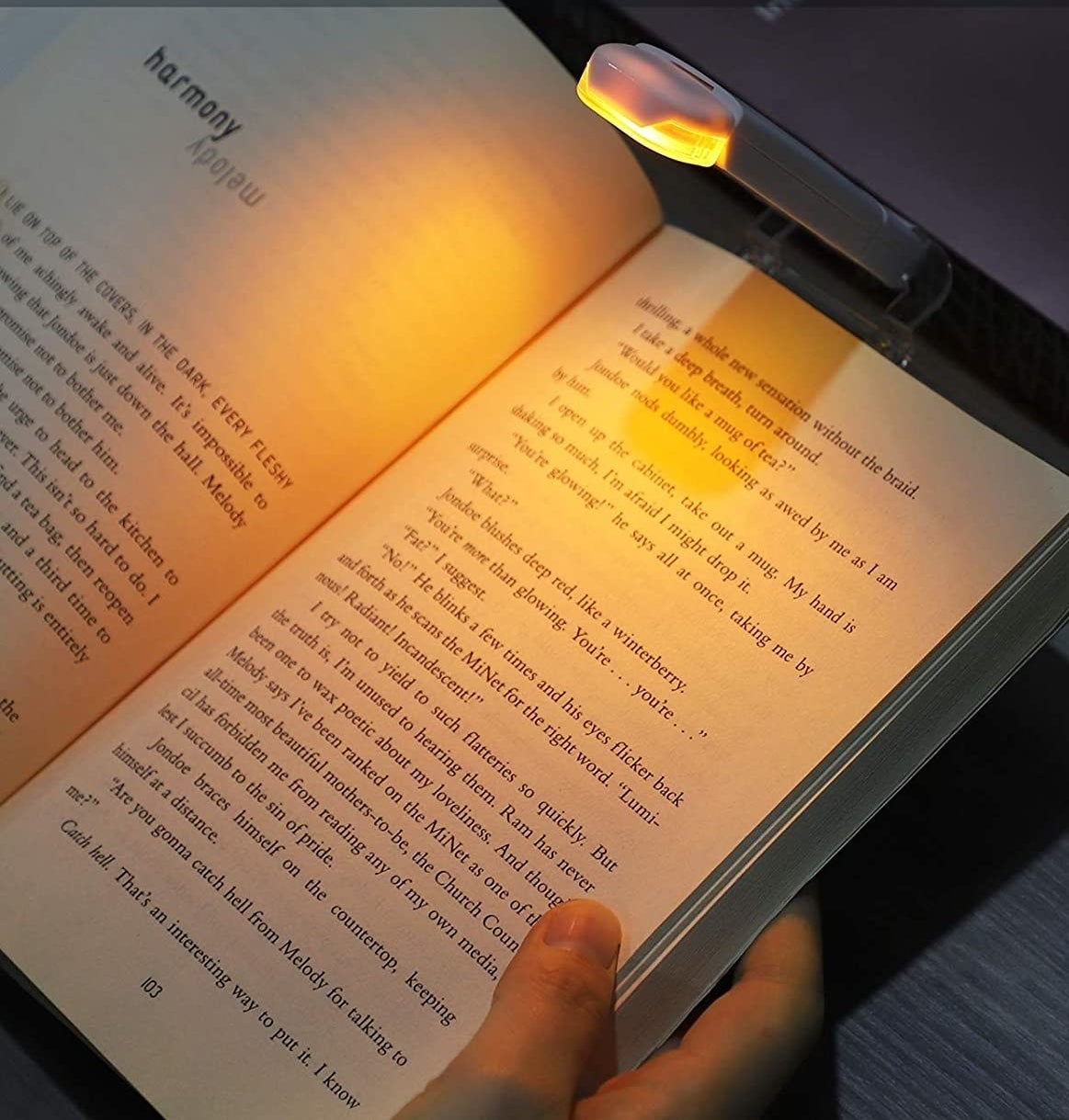 the book light shining soft warm light onto the pages of a book