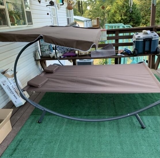 brown outdoor patio daybed on reviewer&#x27;s deck