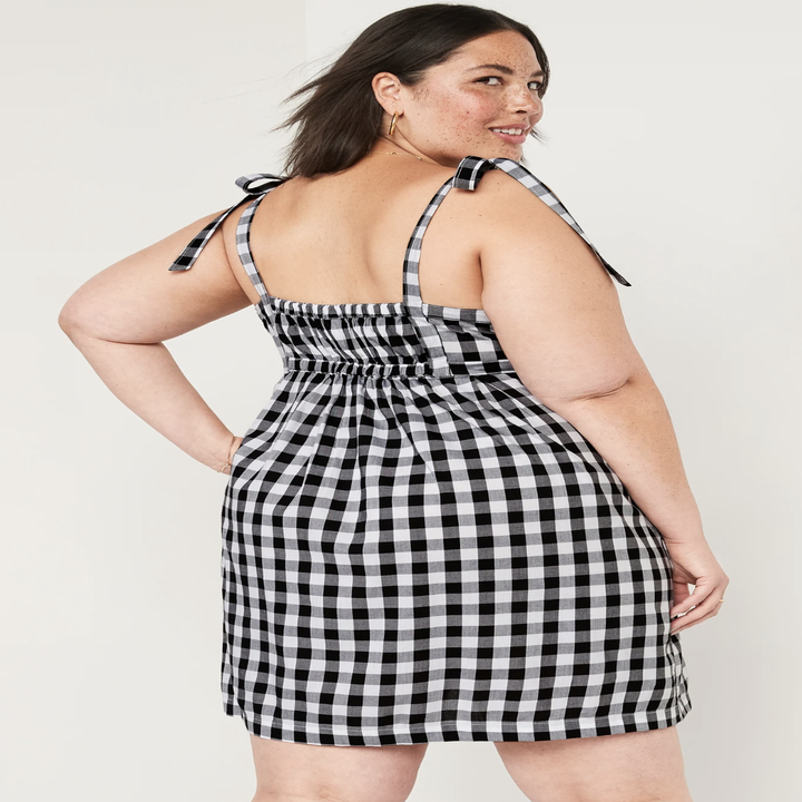 A person showing off the back of the dress