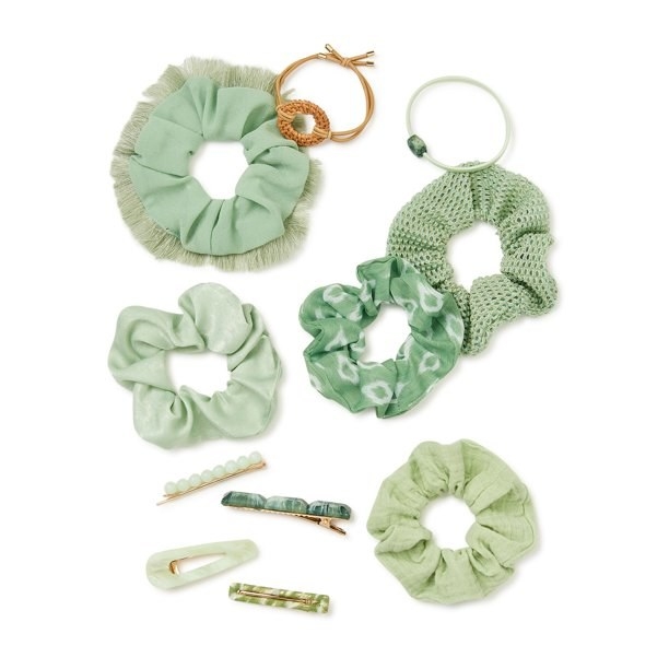 A set of green hair accessories including clips and pony tail holders.