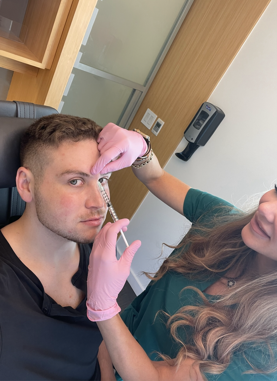 Dr Dendy applying Botox to Ryan&#x27;s forehead