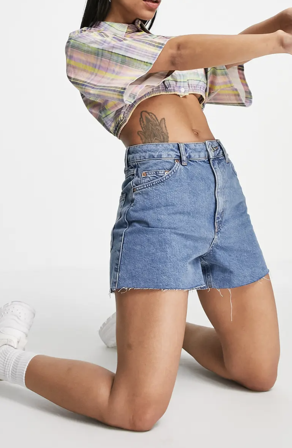 model kneeling wearing the shorts