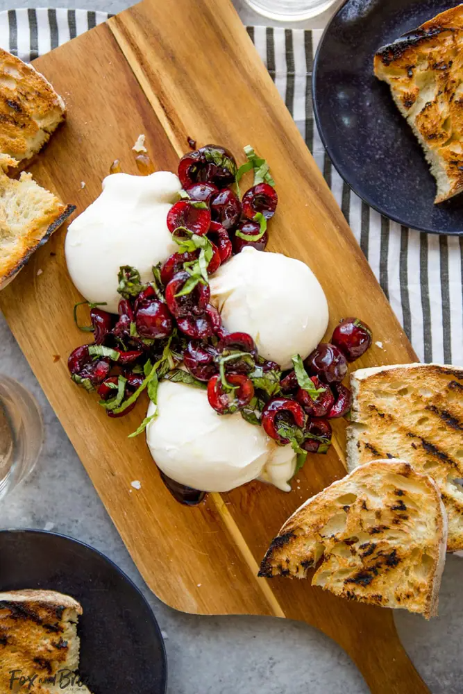Toasted sourdough with Burrata and cherries.