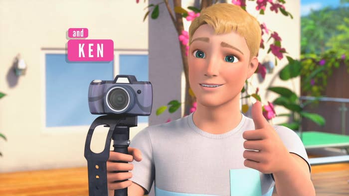 close up of Ken holding a video camera