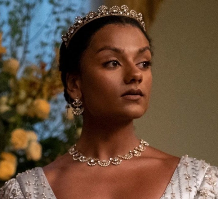 Simone in a jeweled crown, earrings, and matching necklace