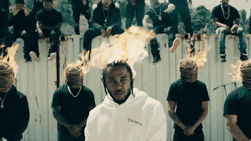 A gif of Kendrick with his head on fire in his music video for &quot;HUMBLE&quot;