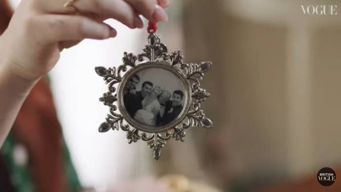 A family photo in a frame shaped like a snowflake