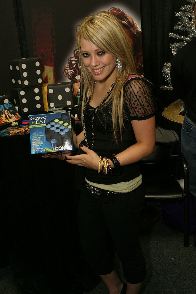 Hilary holding a package of Conair Instant Heat curlers
