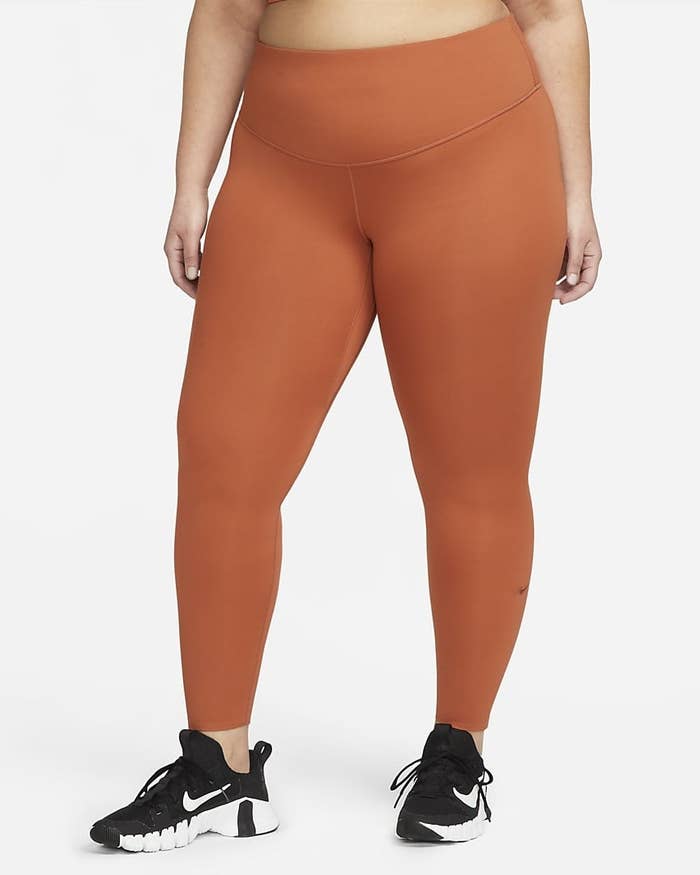 model in orange leggings