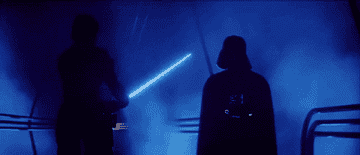 Darth Vader igniting his lightsaber in front of Luke in &quot;The Empire Strikes Back&quot;