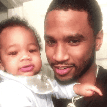 Musical artist Trey Songz with his child