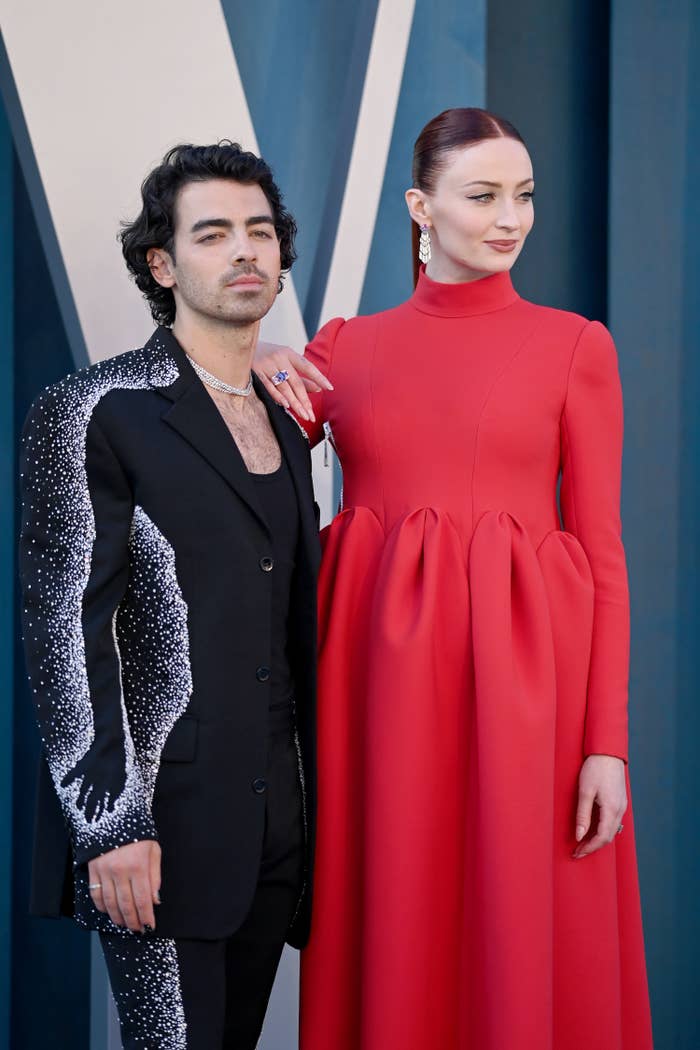 Joe poses with Sophie on the red carpet