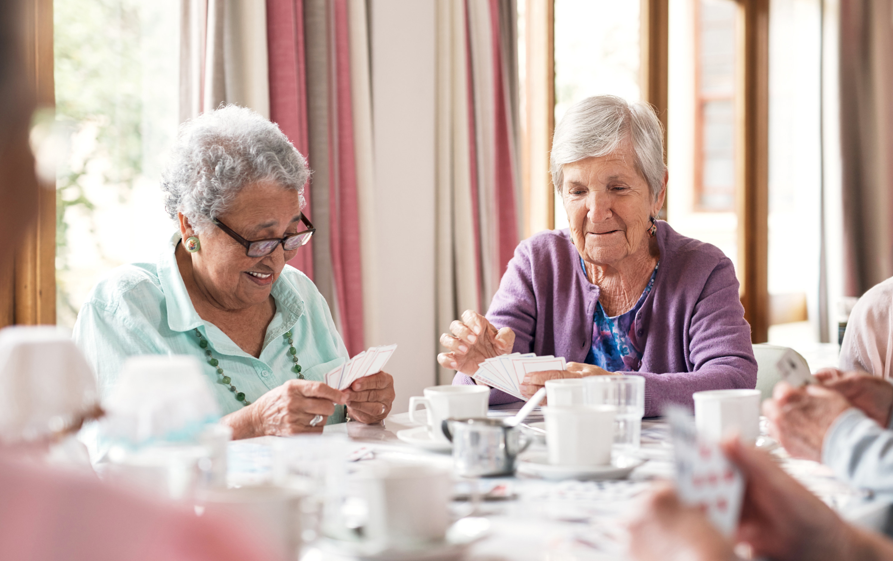 Women playing cards at a retirement home