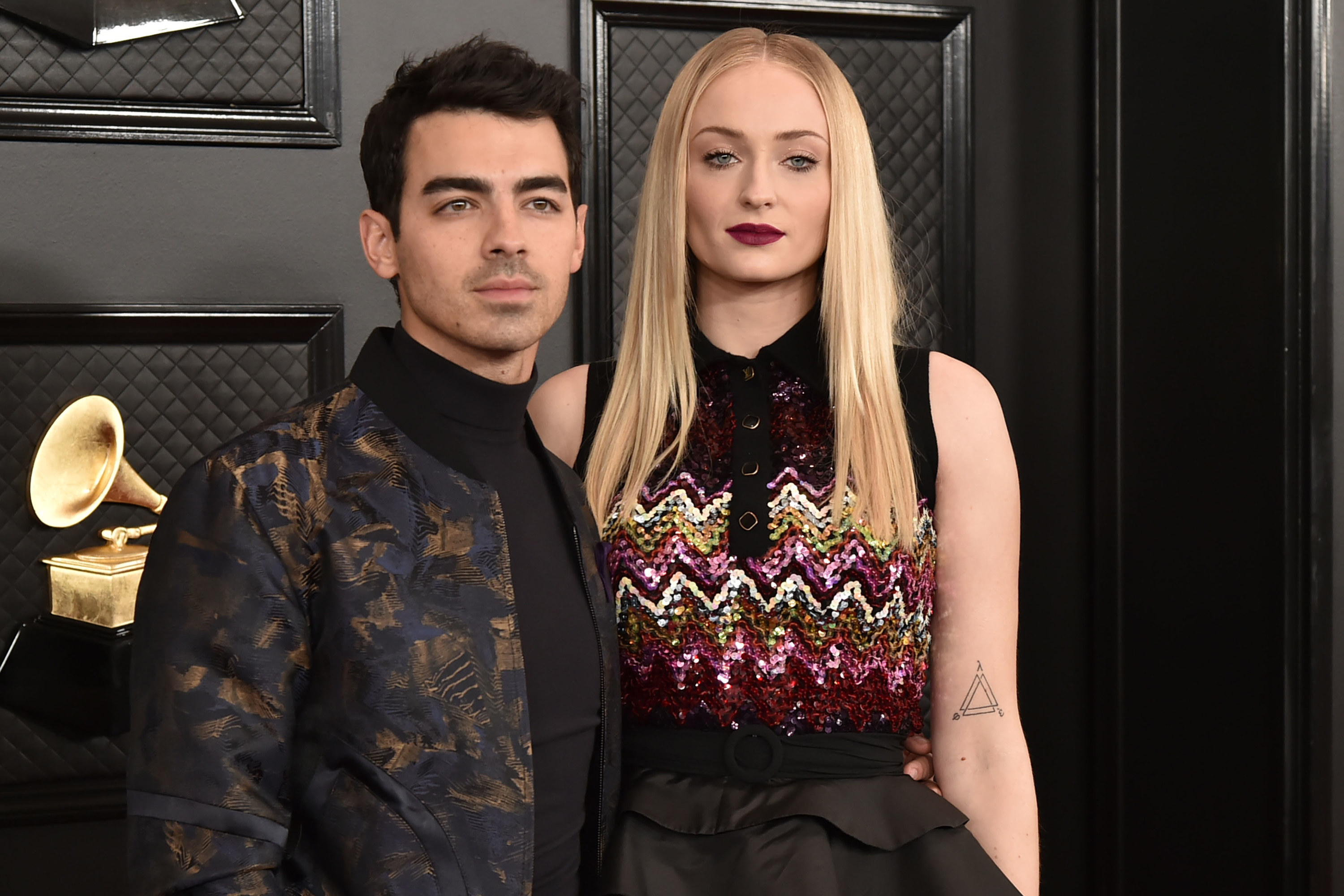 Sophie and Joe pose at the Grammys