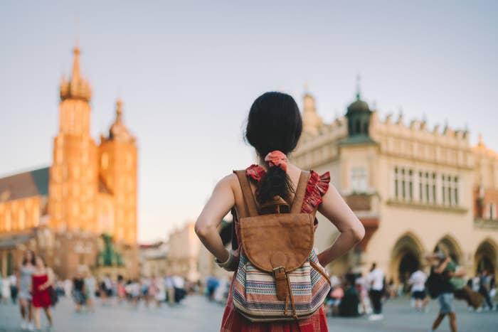 Young woman with a backpack in a foreign country
