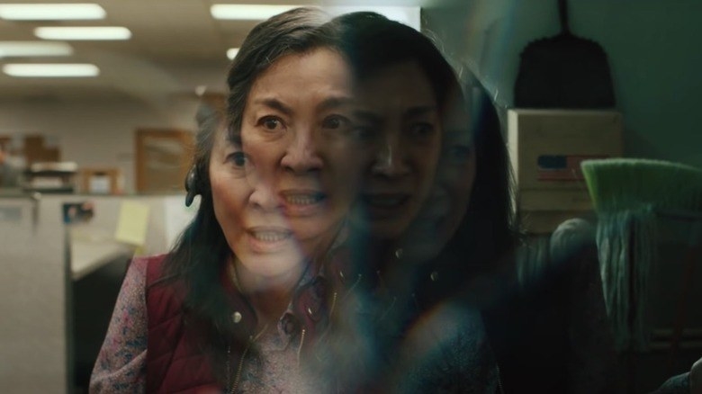 Michelle Yeoh as Evelyn with her face looking refracted and split into many different places