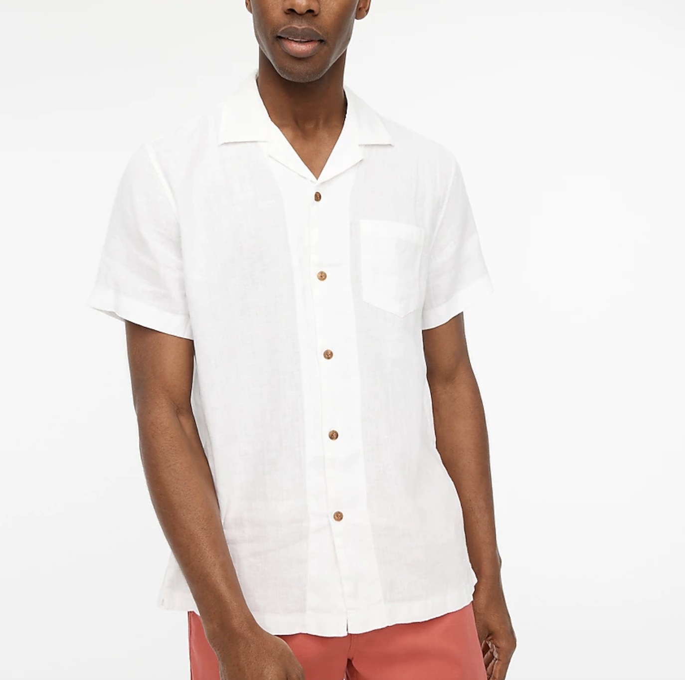 model wearing the linen camp shirt in white