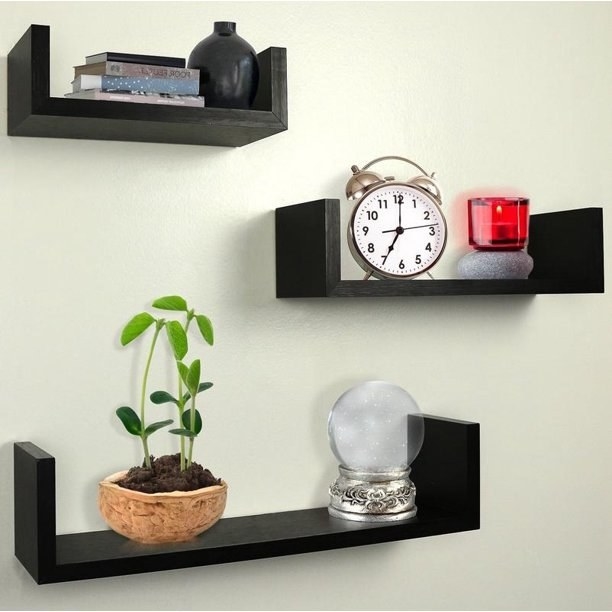 An image of a set of three u-shaped floating shelves mounted onto the wall