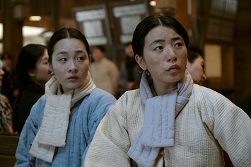 two women wearing scarves