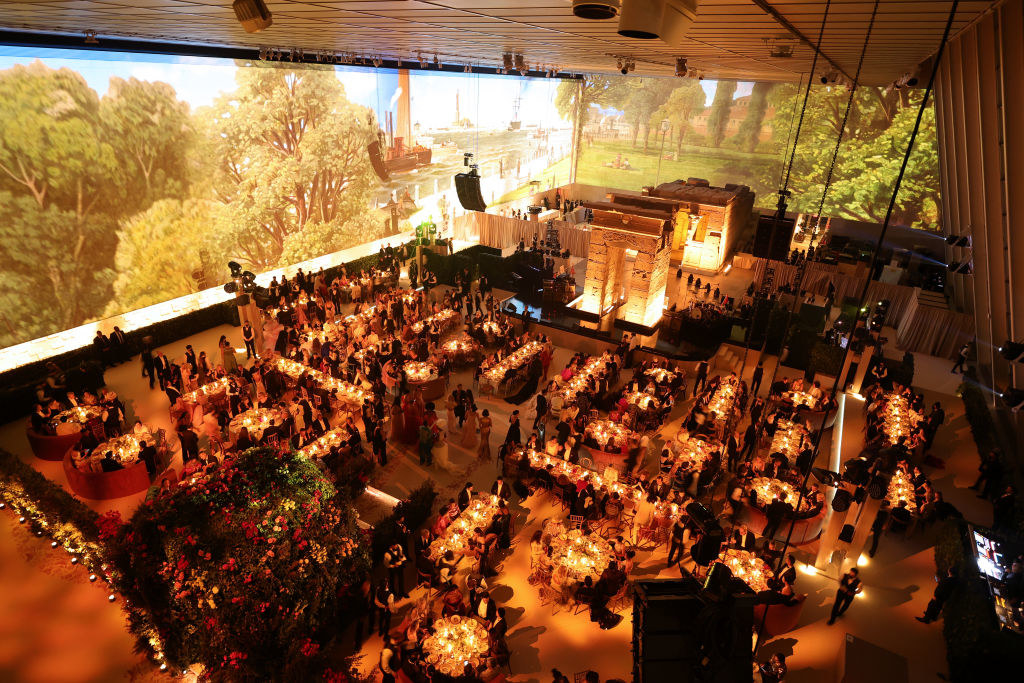 The walls of the event have giant TV screens showing forests and nature