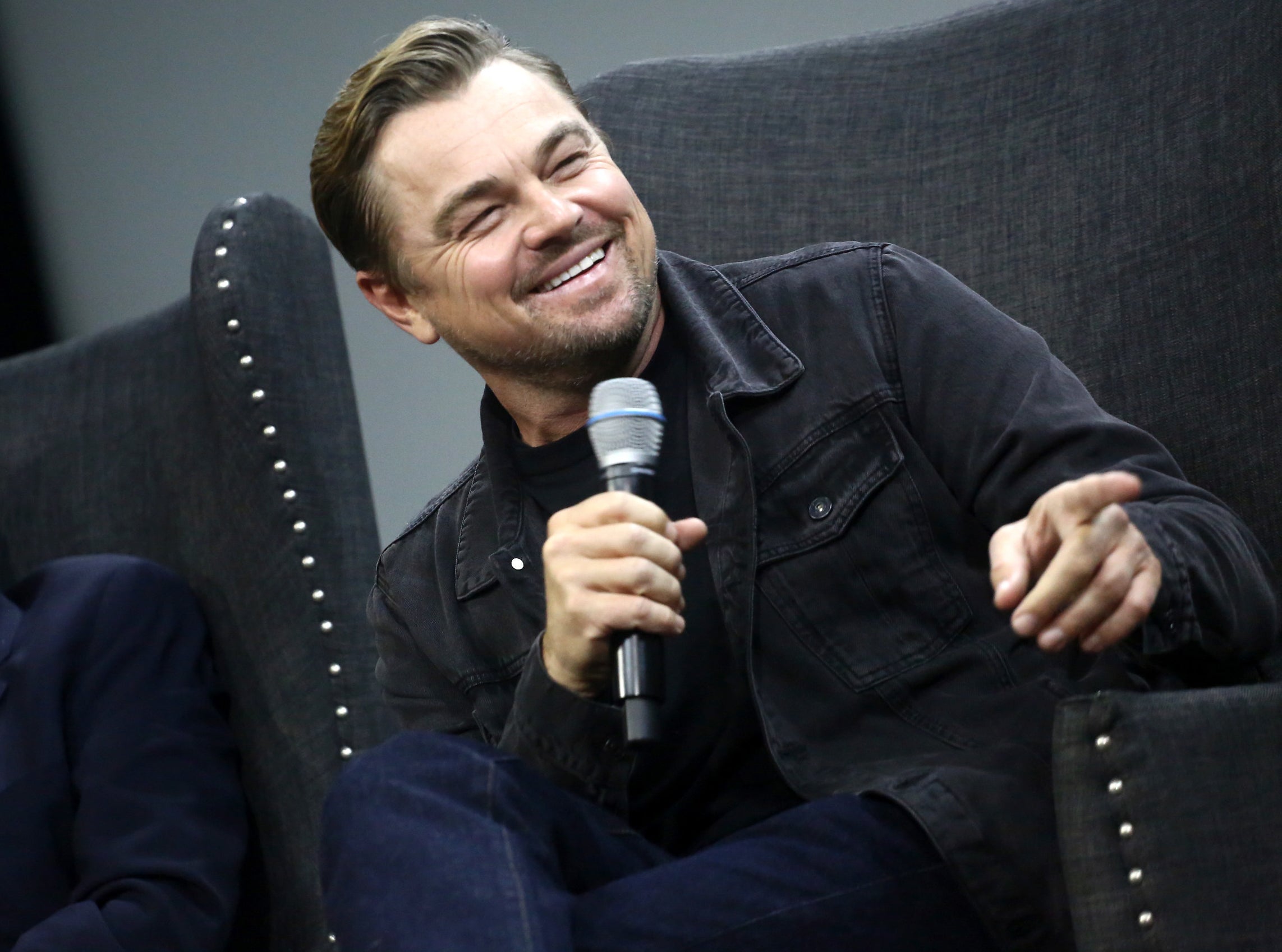 A closeup of Leonardo smiling at an event