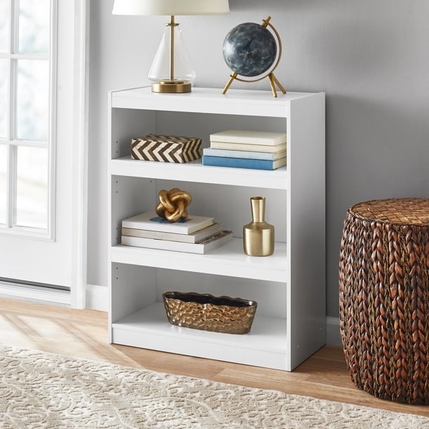 An image of a three-shelf bookcase in a white finish