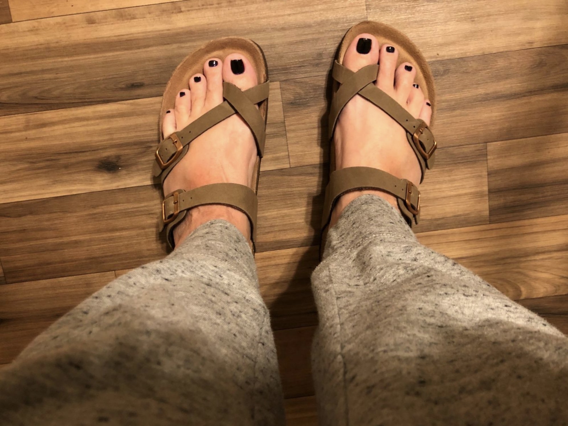 Reviewer wearing the beige toe-cross sandals