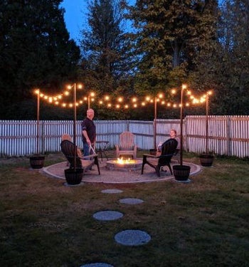 the lights strung up around a firepit