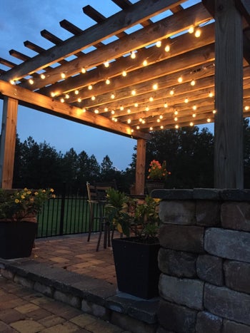 reviewer pic of lights strung up above a patio area